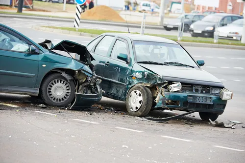 car accident on a street, damaged automobiles after collision in Forest Park, GA