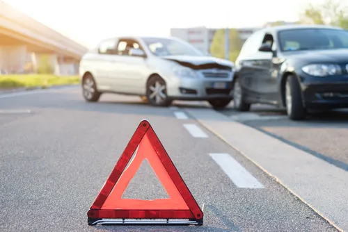 Reflective red triangle to point out a car crash in Monroe, GA