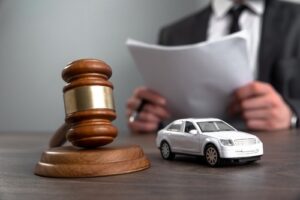 Atlanta Uber accident lawyer with a toy car and judge’s gavel