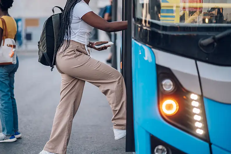 Woman getting on public bus