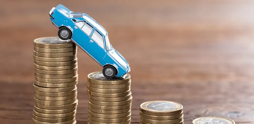 toy car on stacks of coins