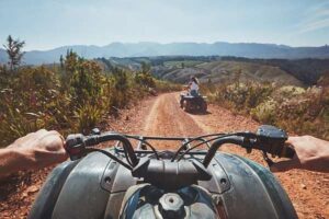 People riding ATVs off-road