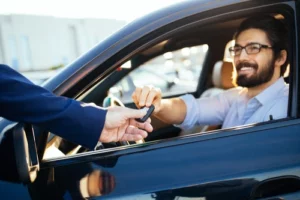 Man Getting Rental Car During Repairs