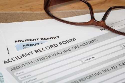 Accident record on desk of a Norcross accident attorney