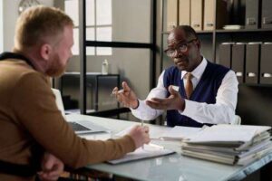 A car accident attorney in Sargent meeting a client