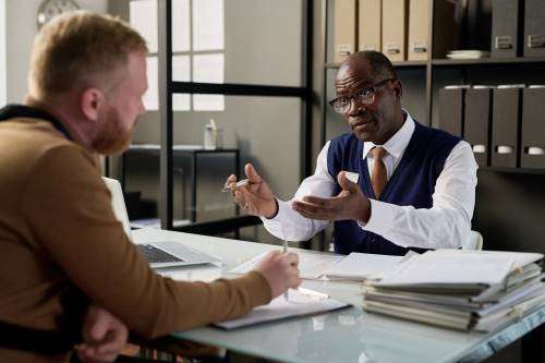 A car accident attorney in Sargent meeting a client