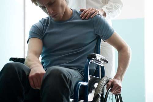Man in a wheelchair, Atlanta spinal cord injury lawyer concept
