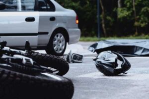 Motorcycle hit by car, concept of motorcycle crashes
