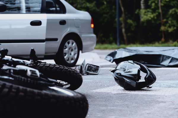 Motorcycle hit by car, concept of motorcycle crashes
