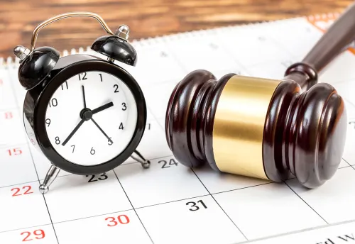 Georgia Car Accident Lawsuit Deadline Concept, Judge's Gavel With Clock and Calendar
