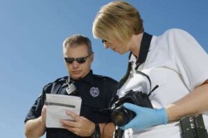 Atlanta police writing a car accident report