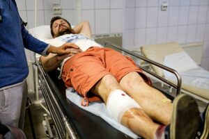 doctor helping car accident victim