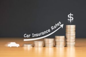 Stacked Coins Showing Car Insurance Rates Increase After Accident