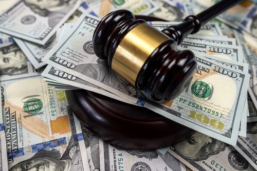 compensatory damages, judge gavel with money