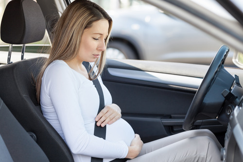 Pregnant Woman in Car