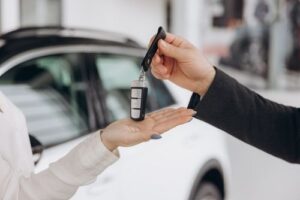 Man Handing Rental Car Keys, Rental Car Accident Concept