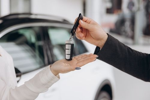 Man Handing Rental Car Keys, Rental Car Accident Concept