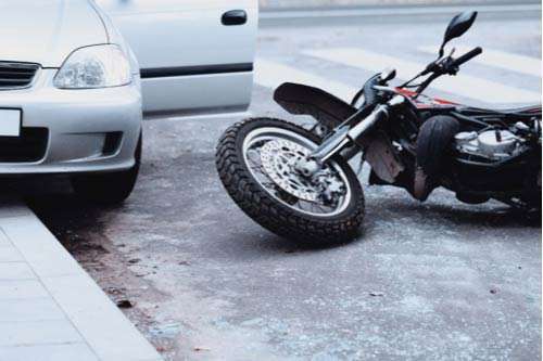 A motorcycle hit by a car