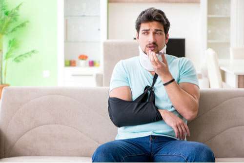 Injured man calling a Roswell pedestrian accident lawyer