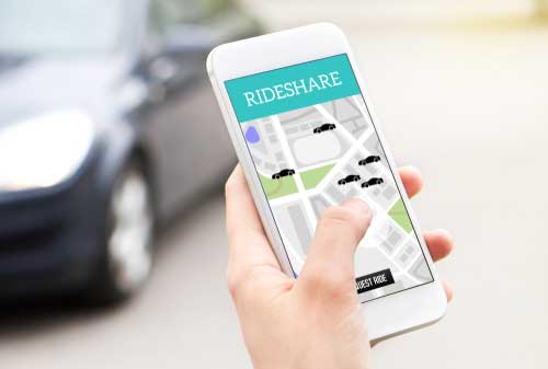 Roswell Uber accident lawyer concept, person using a rideshare app