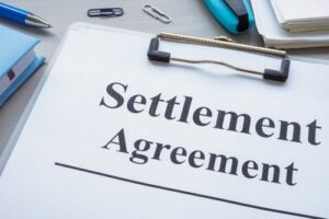 Settlement agreement document, settlement negotiation concept