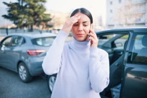 Woman on Phone After Car Accident
