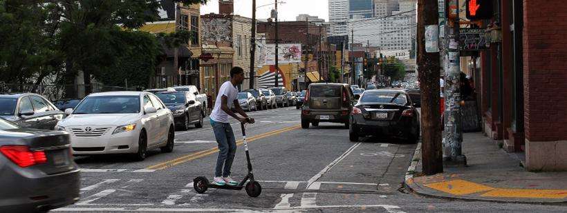 A man uses a Bird scooter in Atlanta to cross the street and if hurt due to someone's negligence, would have a case for a lawsuit.