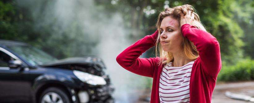 A stressed woman who suffered a car accident in Atlanta and seeks representation from an accident lawyer in Atlanta from The Weinstein Firm