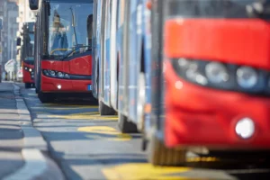 queue of red buses