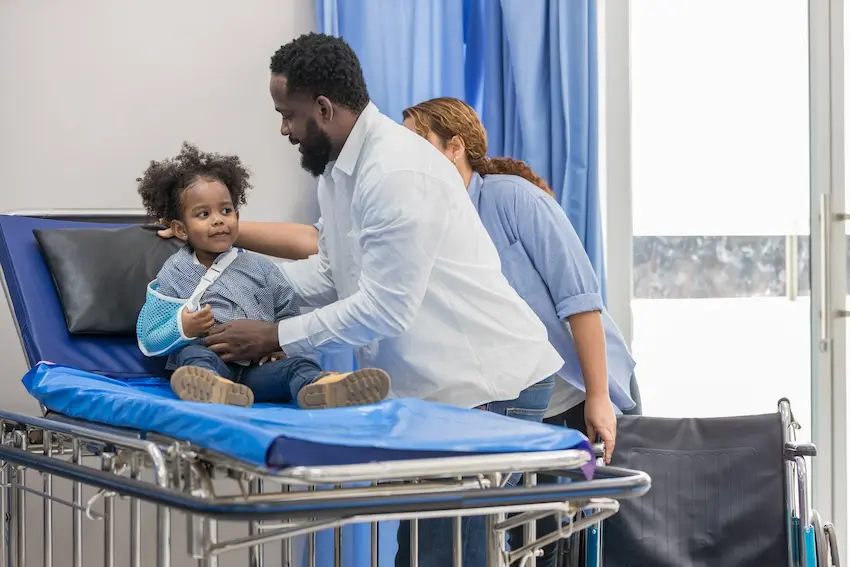 Parent comforting injured child after daycare accident consulting Atlanta childcare injury lawyer