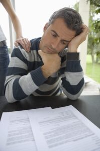 Injured driver evaluating a car accident insurance settlement offer before accepting