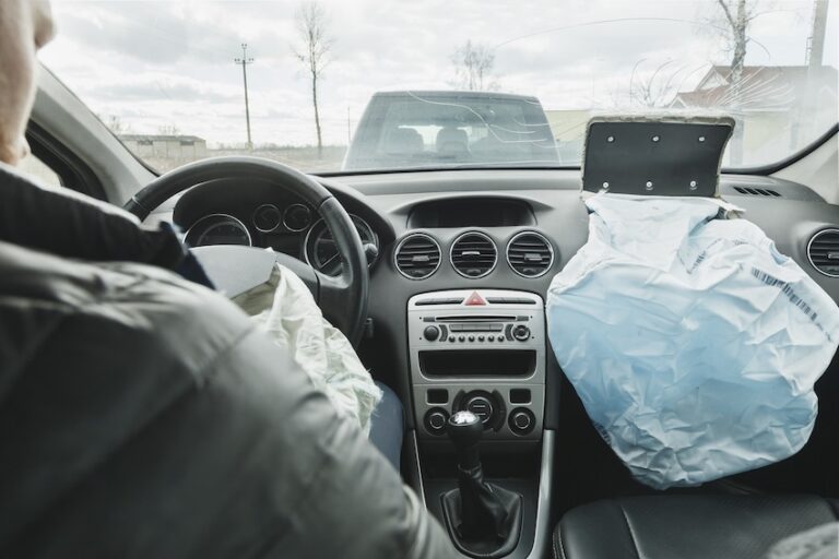 The airbags have deployed inside a vehicle after an airbag accident which shows both the driver and passenger side safety systems activated in Georgia.