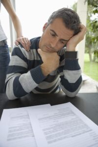 Injured driver evaluating a car accident insurance settlement offer before accepting