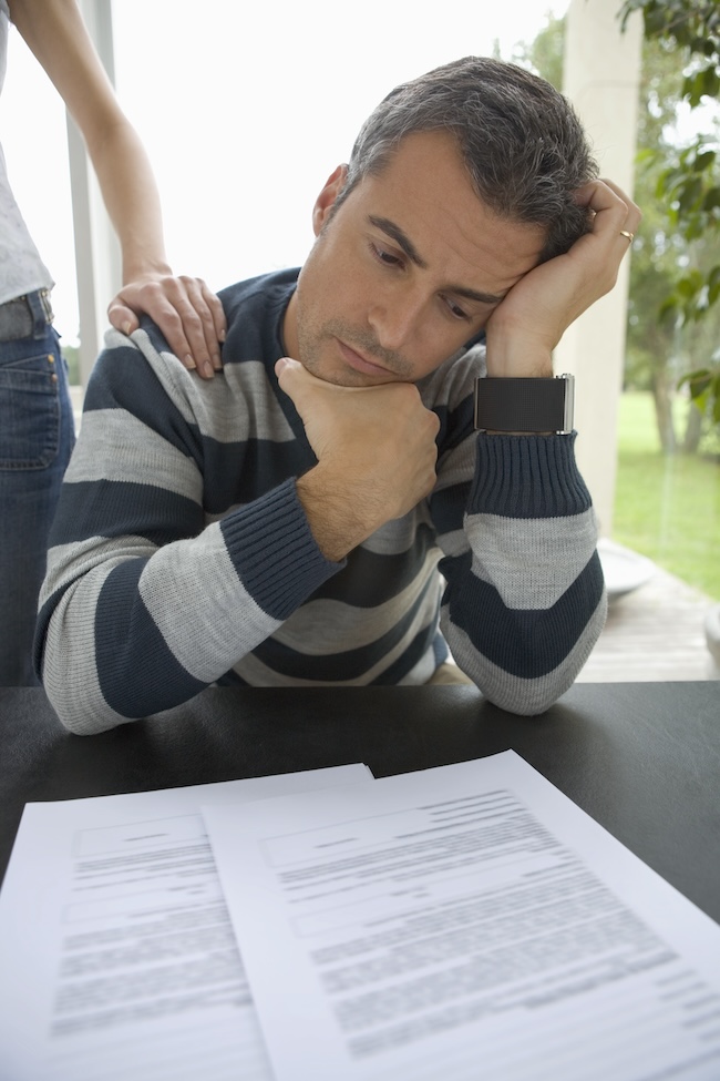 Injured driver evaluating a car accident insurance settlement offer before accepting