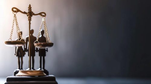 Image depicting a legal scale or a group of people representing different parties (driver, company, third-party) to symbolize shared legal responsibility.