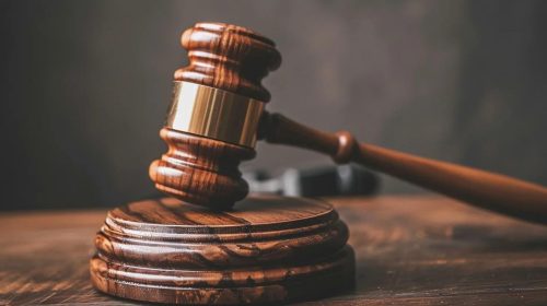 Image of a gavel hitting a sound block, symbolizing the legal action help received by a truck accident lawyer